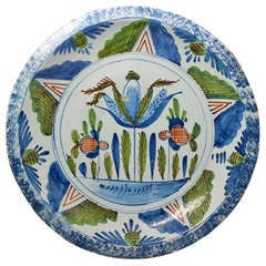 English delftware charger 18th century decorated with a blue sponged border