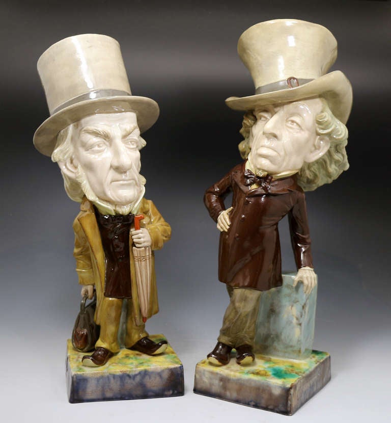 A rare pair of large Victorian pottery political caricature figures of Disraeli and Gladstone the two most important first ministers in the Queen's reign. Disraeli was quite a Dandy in his dress sense and possessed a wicked and lively wit which made