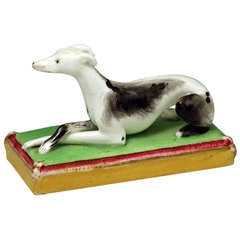 Staffordshire figure of a whippet on base, antique period circa 1840