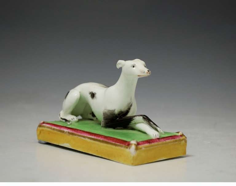 English Staffordshire figure of a whippet on base, antique period circa 1840