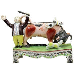 Antique figure of a bull baiting group on a table base by Obadiah Sherratt c1820