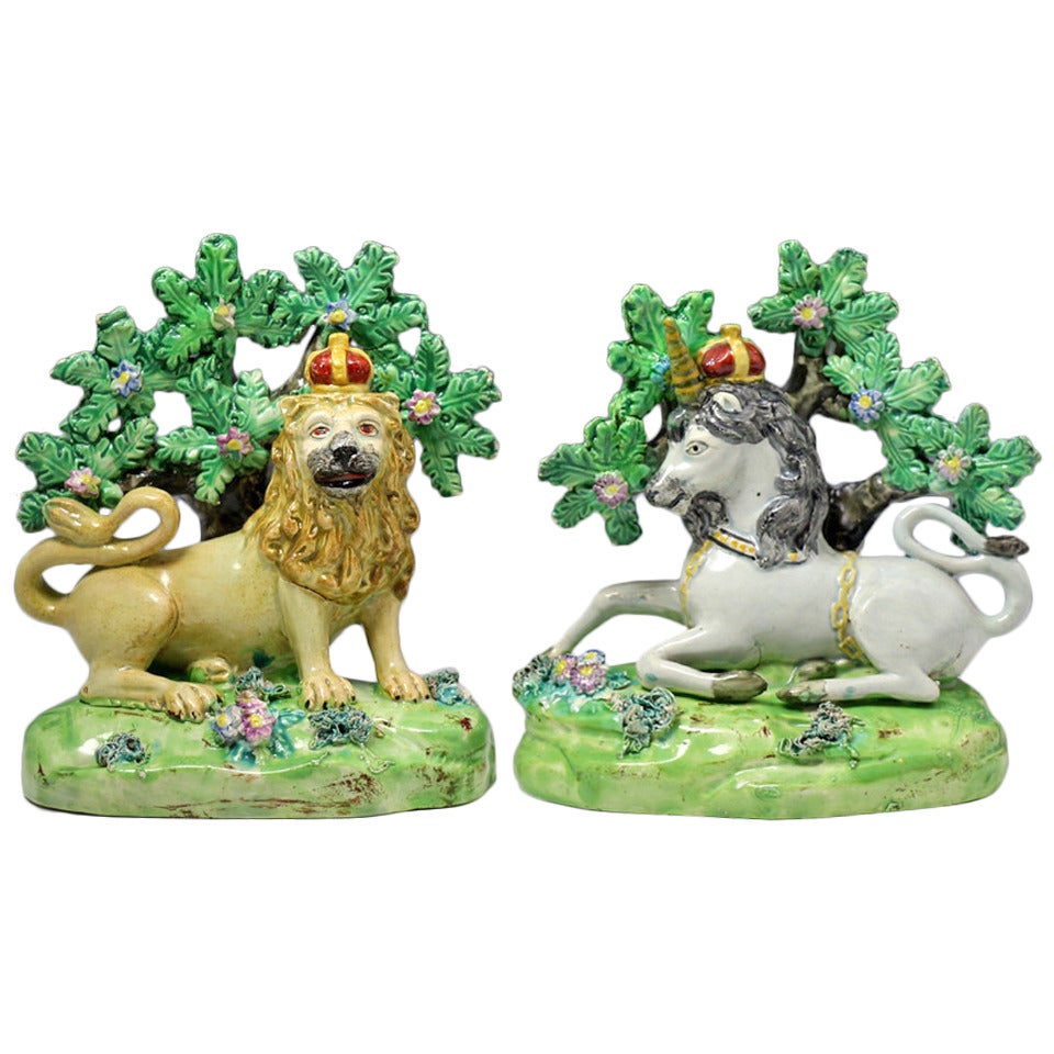 Pair of antique Staffordshire pottery figures of the Lion and Unicorn