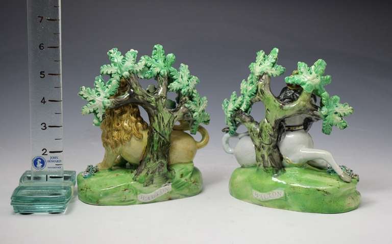 English Pair of antique Staffordshire pottery figures of the Lion and Unicorn