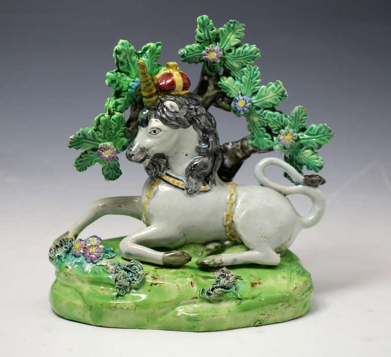 19th Century Pair of antique Staffordshire pottery figures of the Lion and Unicorn