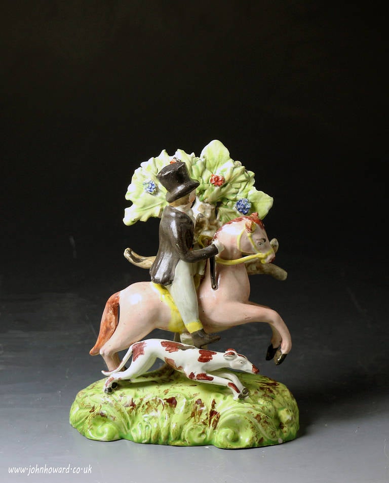 A rare well modelled and decorated pearlware figure of a male equestrian with bocage. 
This Staffordshire figure dates to circa 1820 period. 
Comprehensive attention to detail denotes the quality and appeal of this figure.
