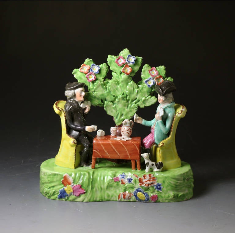 A rare fine quality antique pottery figure group of Doctor Syntax playing at cards. 
The figure is Obadiah Sherratt type from Staffordshire and was made around the 1820 period. 
This figure is one of the most detailed and largest examples of