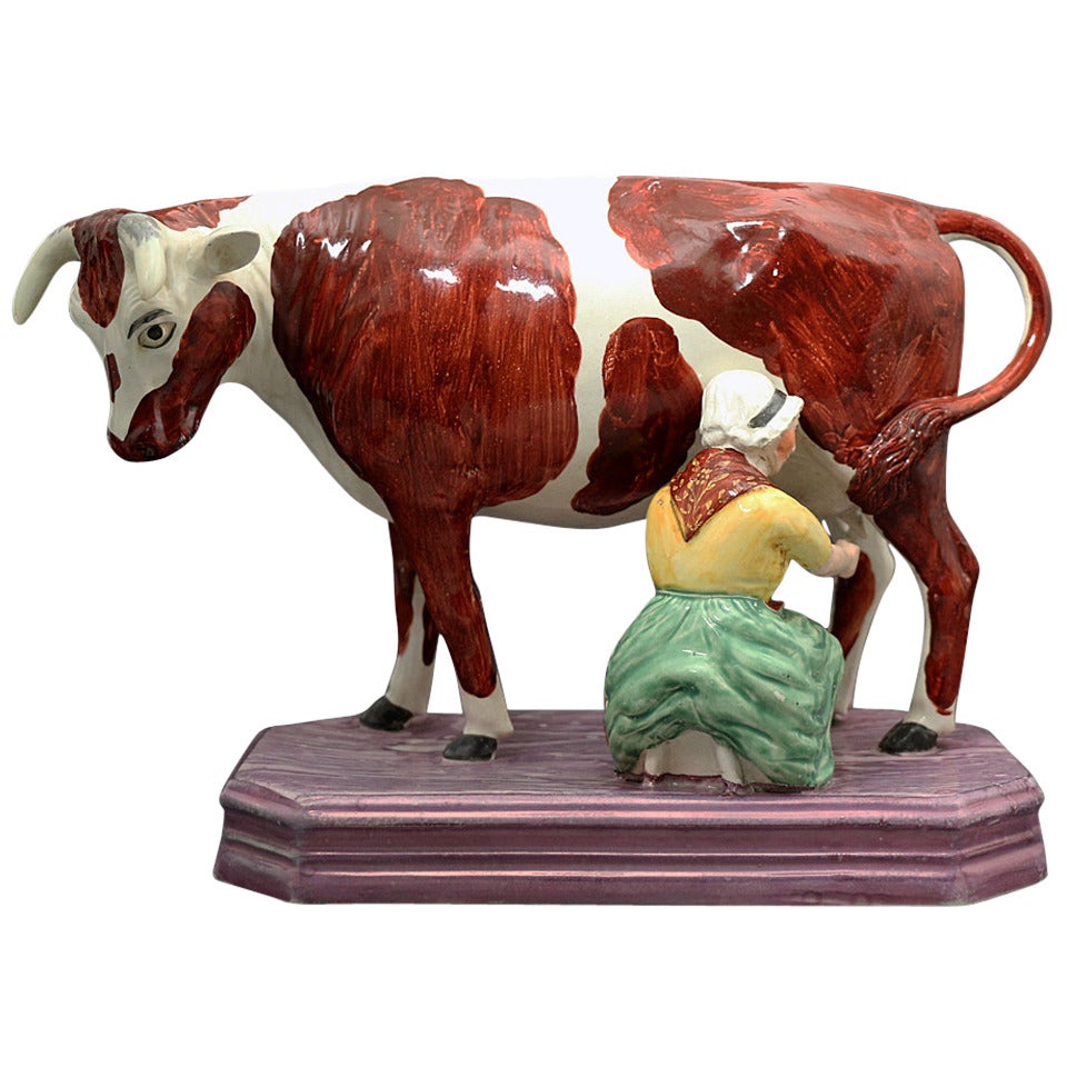 Large Figure of Cow and Milk Maid with a Pink Luster Base
