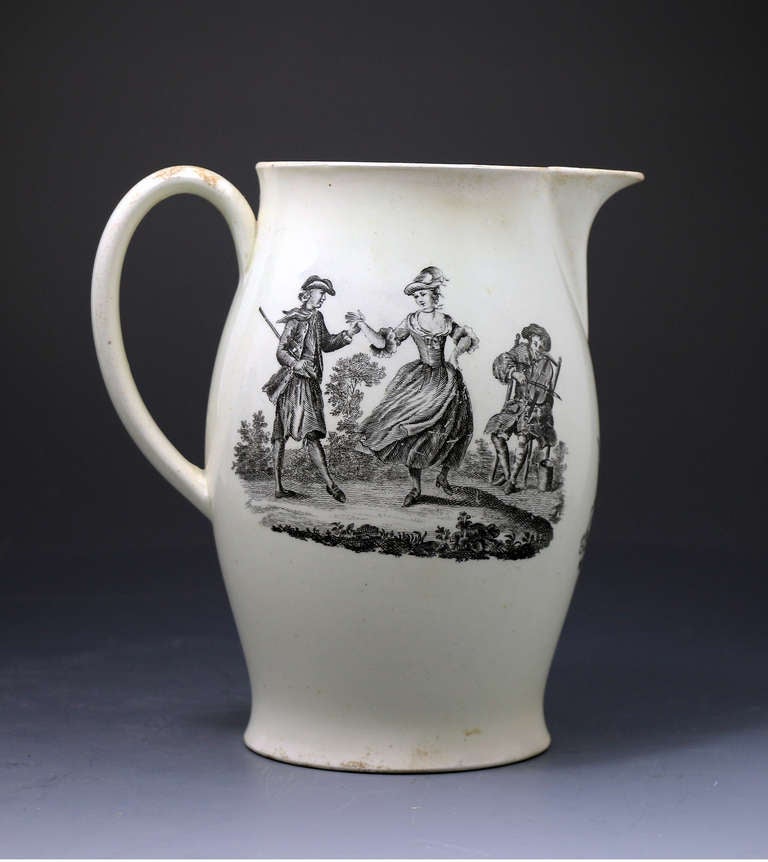 Antique period English pottery creamware pitcher with transfer printed decorations. 
One image depicts a rather genteel couple dancing to a tune played by a seated man playing the fiddle. The centre image under the spout is of a tulip and other