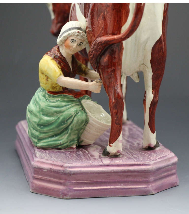 English Large Figure of Cow and Milk Maid with a Pink Luster Base