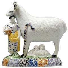 Antique period Yorkshire pottery figure of a ram with female attendent