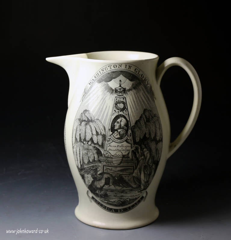 A fine antique creamware pottery jug with underglaze transfer prints relating to the first President of the United States George Washington.