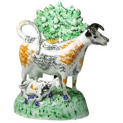 Antique English Pottery Figure of a Cow Creamer with Bocage, circa 1800