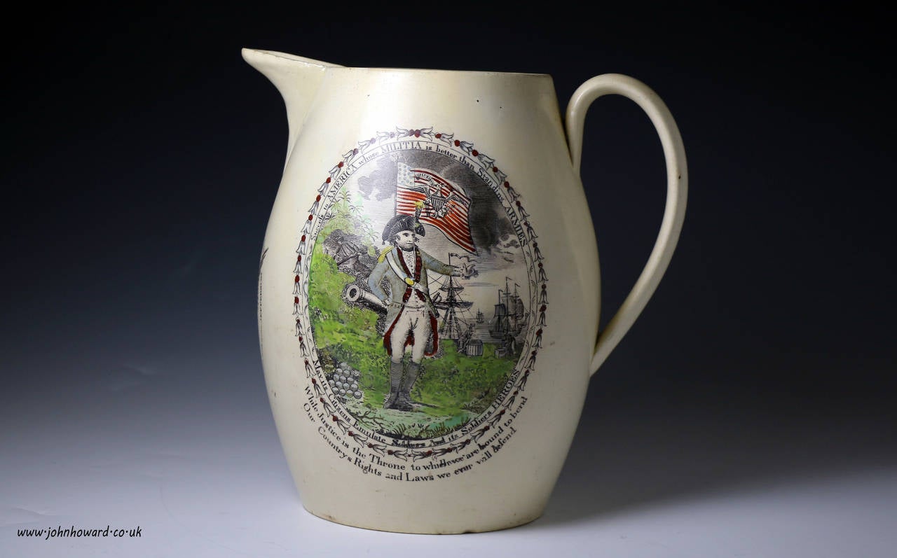 Polychrome probably Liverpool Creamware Pitcher . 
One side of the pitcher has a Revolutionary War Officer probably General Washington with Cannon's and an American Flag with 15-Stars and Sailing Ships unloading cargo in the background.The