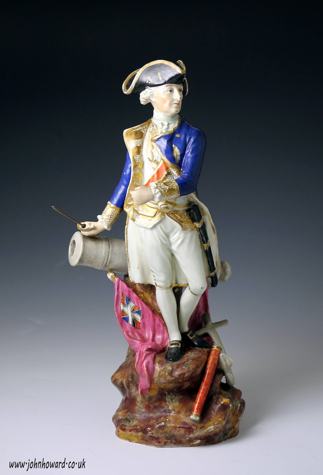 A very rare Staffordshire pottery pearlware figure of Lord Rodney. 
The figure is extremely well modelled and decorated. Rodney is standing on a rocky mound surrounded by flags, a cannon,anchor with a telescope resting by his feet. Rodney is