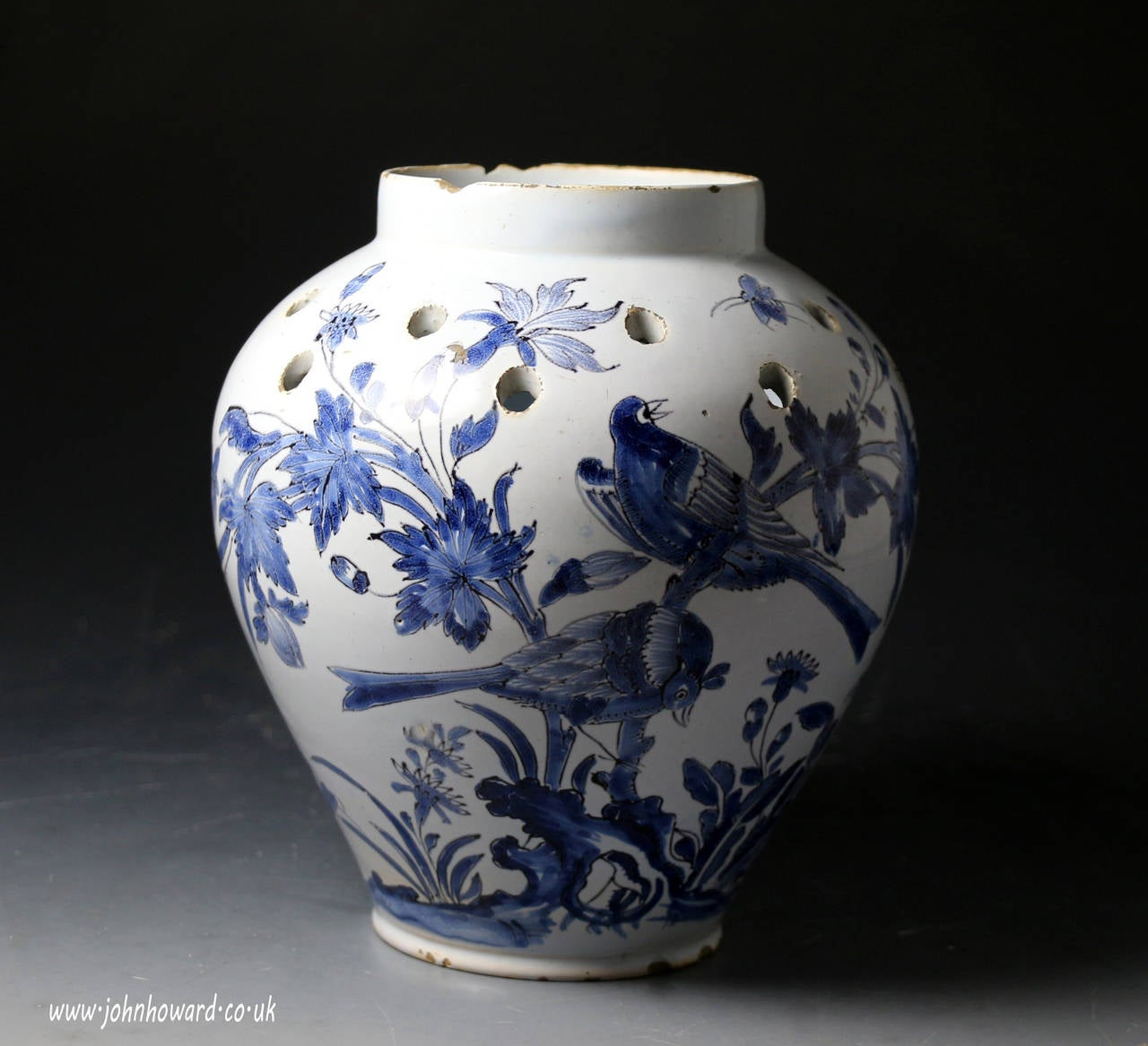 A very rare delft blue and white pottery vase with pierced holes at shoulder for flower arrangments, a most unusual form.