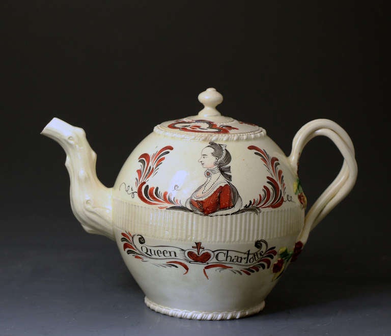An extremely rare English creamware pottery teapot with an image and script Queen Charlotte.Charlotte (of Mecklenburg-Strelitz) 
was the German wife of King George III (also German). She was Queen of Great Britain and Ireland from their marriage