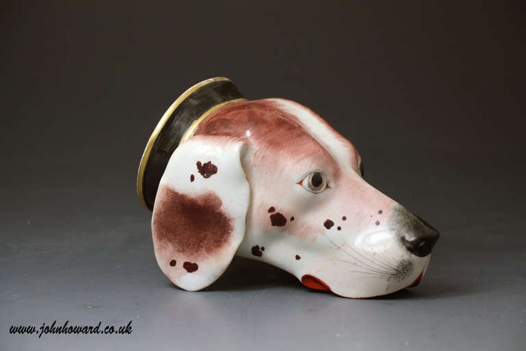 A very fine example of a hound head stirrup cup. The modelling and decorative skill applied to this stirrup cup are incredibly life like making it one of the best hound stirrup cups ever produced. Superb quality piece from the famous Derby Porcelain