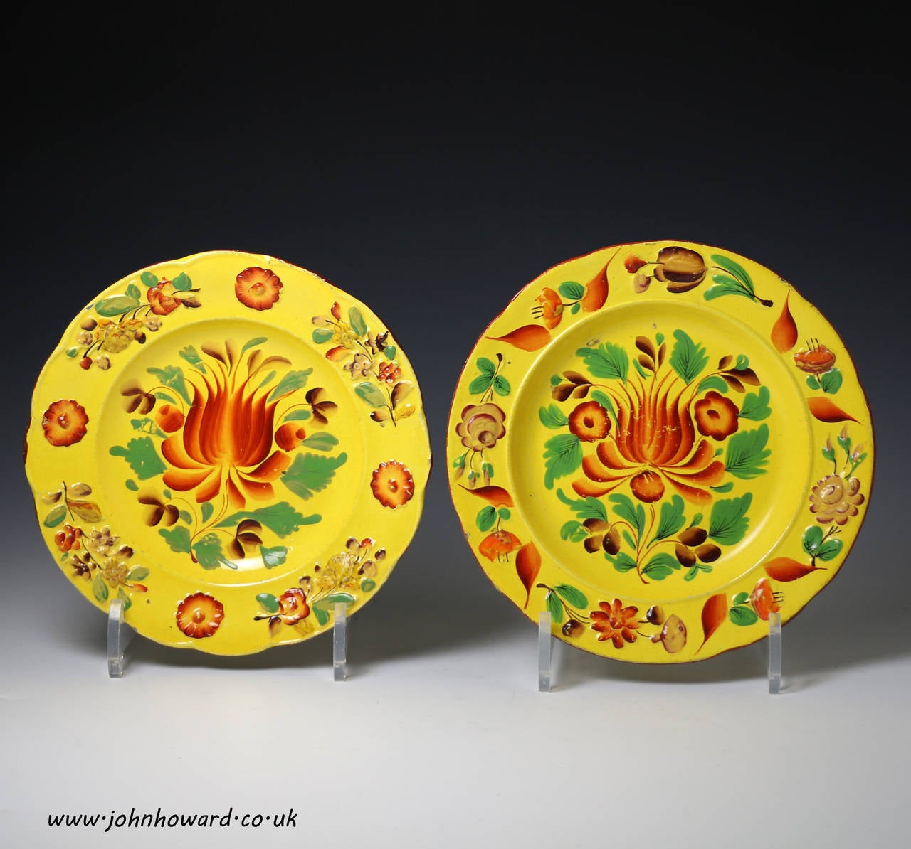 Two Canary Yellow Pottery Plates with Bright Enamels, Probably