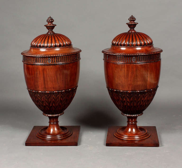 An impressive pair of George III style mahogany knife urns with finely carved detail. Probably made in the first half of the nineteenth century. 

Provenance: No. 6, The Circus Bath 

Style of ROBERT ADAM (1728-1792)