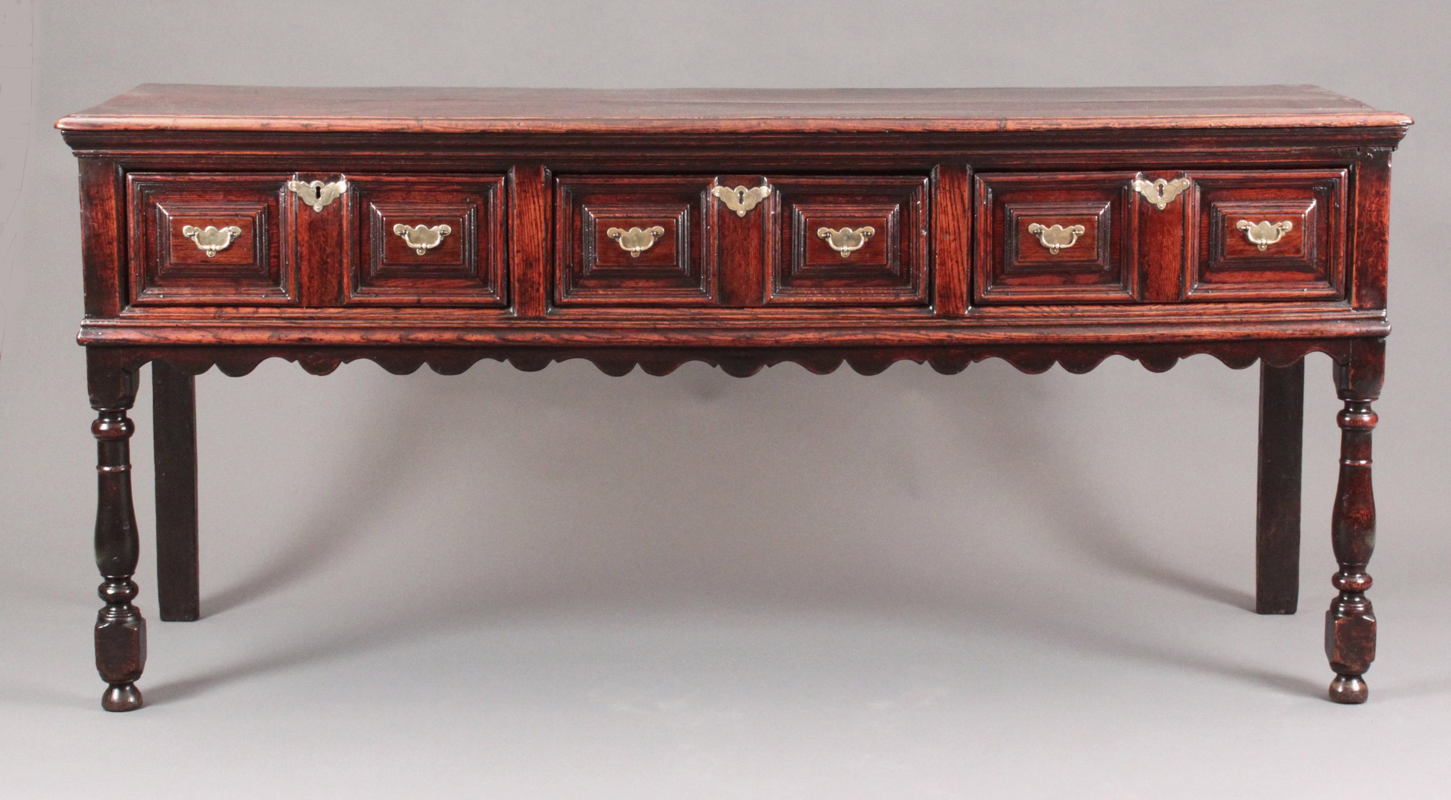 A fine William and Mary moulded front serving dresser