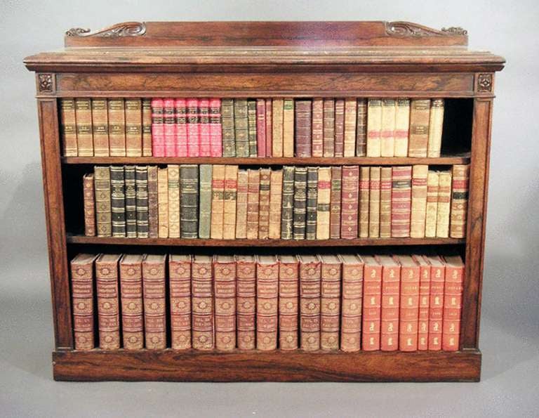 Regency Rosewood dwarf bookcase with original inset grey fossil marble top, good crisp carving and adjustable shelves. 