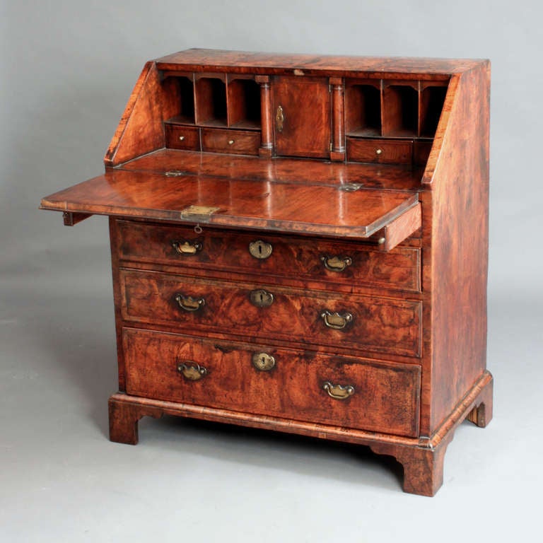 An early eighteenth century veneered walnut bureau of a good original colour and patina.