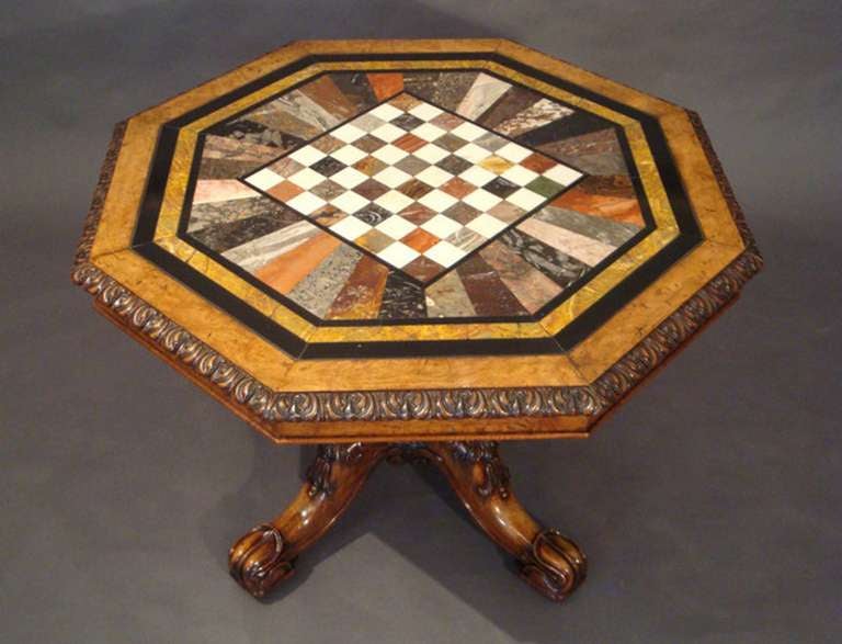 An exceptional Regency walnut centre table with a specimen marble top on a bold well-carved four-splay base; perhaps by Gillows of Lancaster.