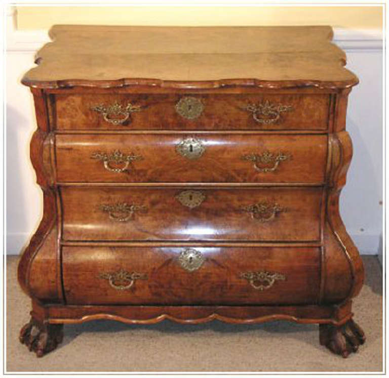 A Dutch bombe chest in finely figured walnut veneers on carved claw feet c.1760 

Holland.