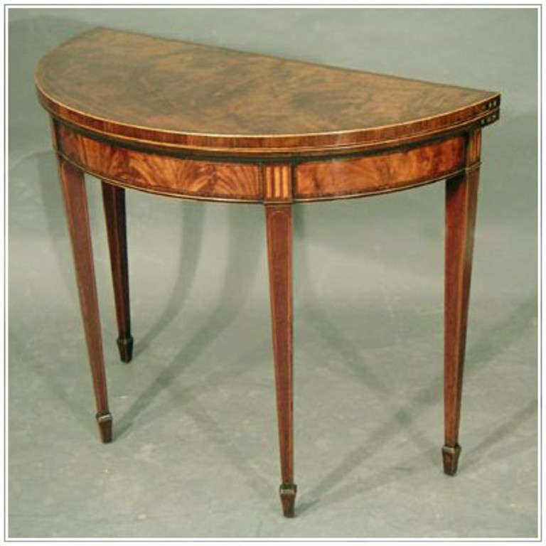 An elegant Sheraton mahogany card table with rosewood cross banding and boxwood and ebony inlays and stringing; lovely figured timber, colour and patina circa 1785.