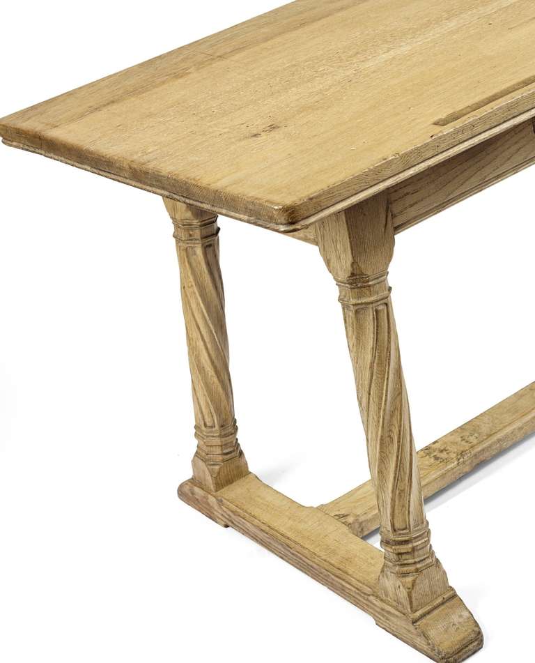 A bleached oak draper's table designed for Liberty's by Sir Robert Lorimer