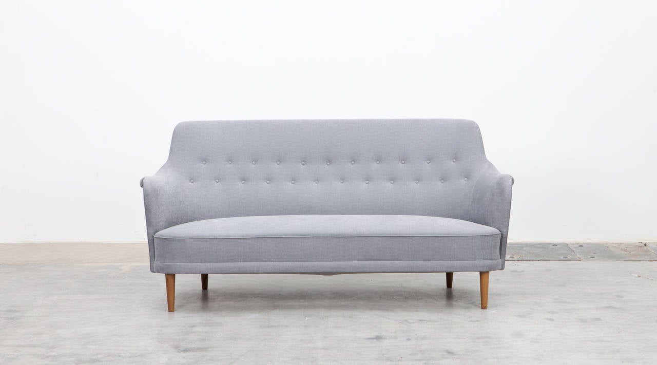 Sofa with new upholstery by Carl Malmsten, Sweden, 1960

Beautiful sofa designed by Carl Malmsten. The new upholstery with the bright high-quality fabric supports the organic shape of the sofa. The legs are birch and it comes in outstanding