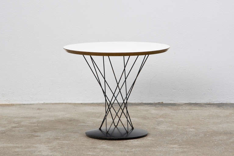 Sidetable with extraordinary base and white laminate top designed by Isamu Noguchi, produced by Knoll International.