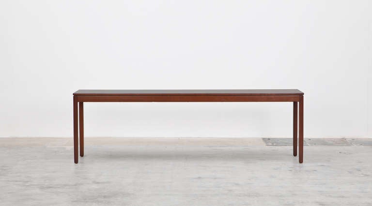 Elegant Console made of walnut is designed by Florence Knoll. The simple design and it pure lines and forms gives every room nobility. Manufactured by Knoll International.