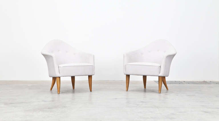 Pair of beautiful armchairs designed by Kerstin Holmquist is new upholstered with high-quality fabric. The chairs comes on beech legs and appears in outstanding condition. Manufactured by Nordiska Kompaniet Verkstader.

A variation on the sober