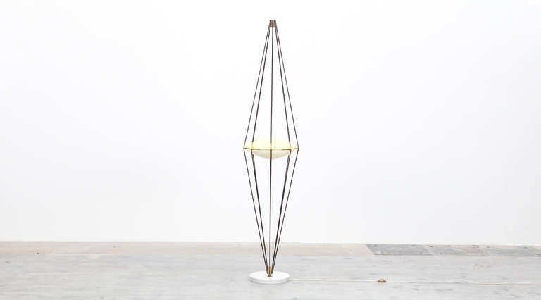 Floor Lamp designed by Italian Angelo Lelli. Plexiglas diffusors in UFO shape, yellow and white, cone-shaped solid brass cylinders screwed to top and bottom. Manufactured by Arredoluce.