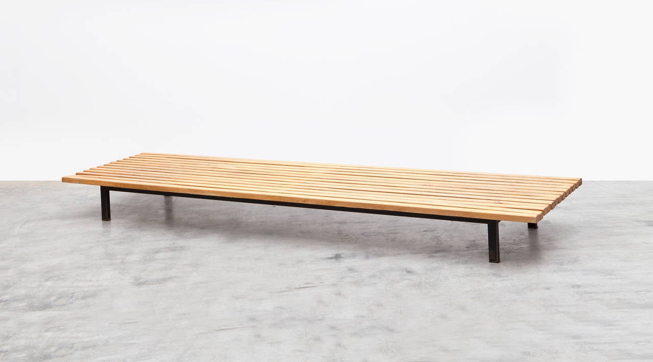 Simple yet originally inventive Perriand bench. Sold and distributed in the 1950s by famous Paris gallery Steph Simon, together with pieces by her frequent collaborator Jean Prouvé. 

Charlotte Perriand is one of the most influential French