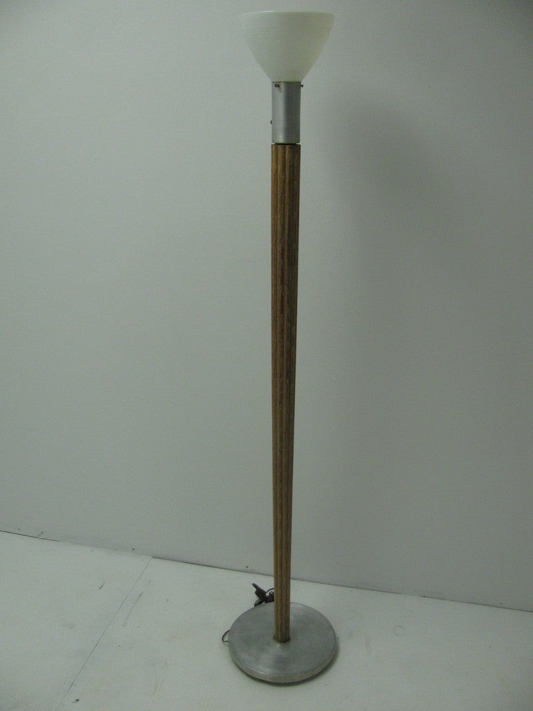 Mid Century Floor Lamp in Aluminum And Oak, By Russel Wright. Oak Shaft is Tapered And Reeded, Capped By Aluminum And At Its Base. Shade Appears Original, Easily Updated.   Please call in advance for an appointment.  845-649-8375