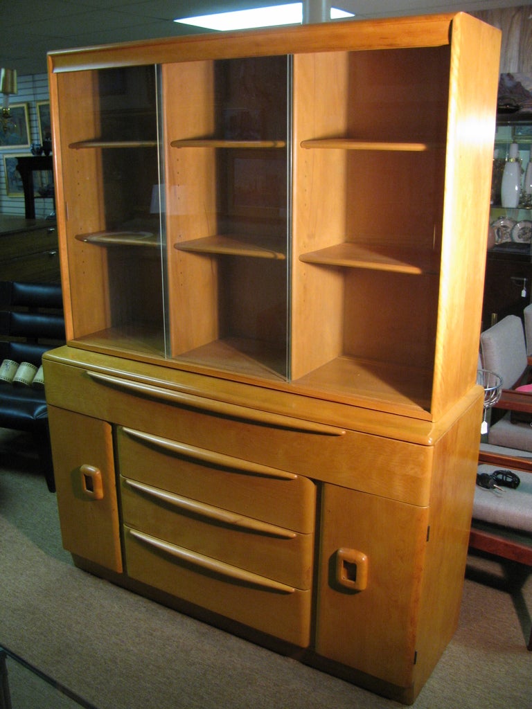 Fabulous Two Piece Cabinet From Heywood Wakefield. French Art Deco And Scandanavian Blond Designs Combined To Help Create American Modernism. Cabinet Has Been Recently Restored To its Original Condition. Top Has Three Sliding Glass Doors, With Six