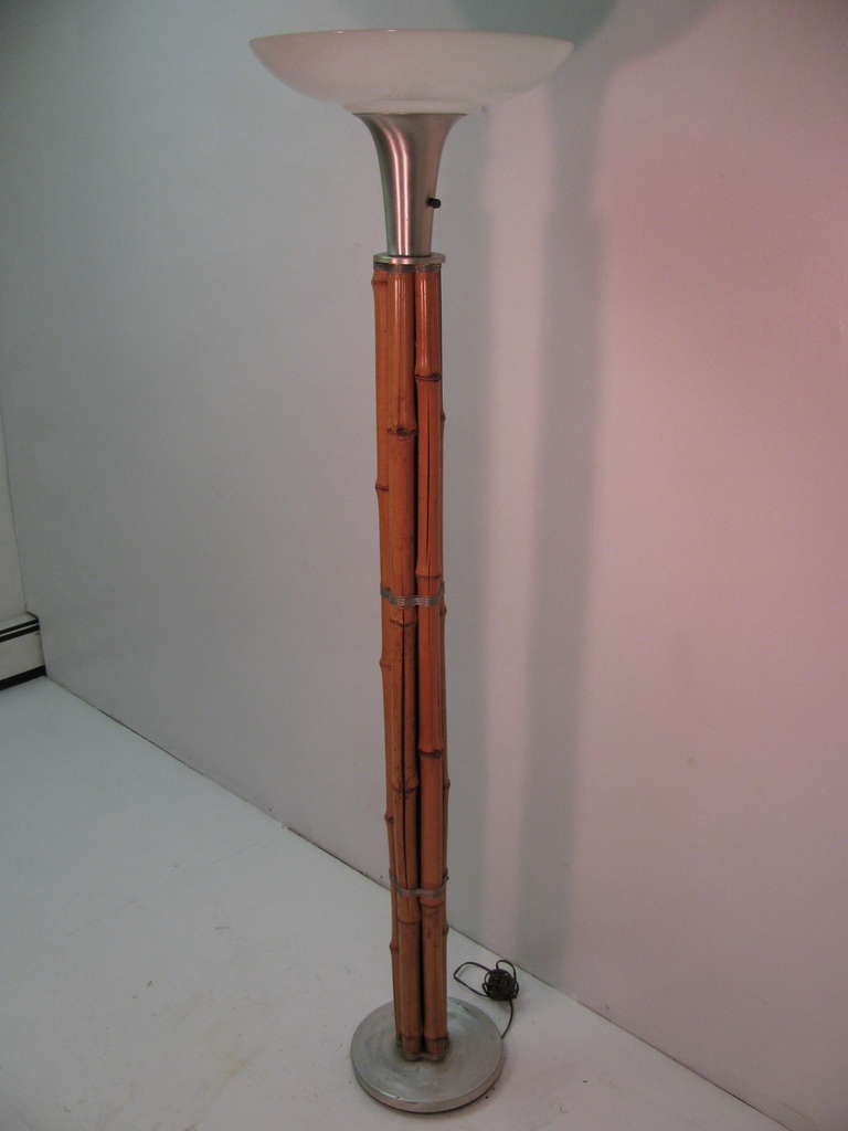 Fabulous Art Deco bamboo floor lamp wrapped with aluminum wire, torch and base.