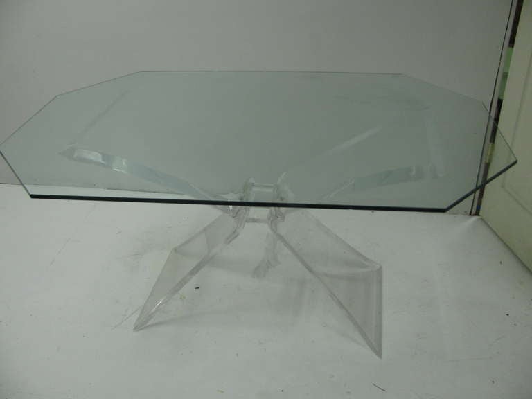 Lucite butterfly base with beveled edges. Octagonal dimensional glass top. Can be used as a desk or console table. In excellent vintage condition with minimal wear.
