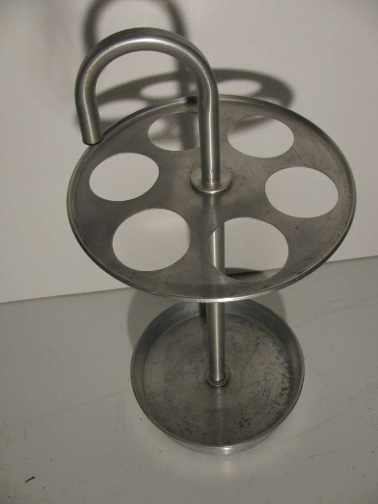 Classic Umbrella Stand From The Warren Mcarthur Corp. Modern Interpretation Of An 19th Century Design. Stand Is In Very Good Condition With Normal Wear To The Base. Anodized Aluminum. Please Call In Advance For An Appointment Or If You Have Any