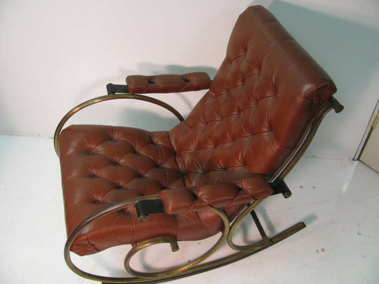 Beautiful Chestnut Colored Tufted Leather With Brass Frame.  Rocker Has Wood Glides That Sit on Lower Portion For Comfort And to Protect Flooring. In Excellent Condition.  All Inquiries Please Call Or Just Press CONTACT DEALER Button.