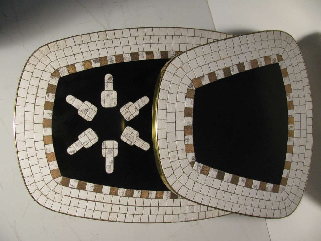 Fabulous Two Tier Tables With An Ancient Tribal Designs On Lower Section. Mosaic Tiles On Outer Edge And Black Laminate In Center. Brass Frames Outer Edges, Brass Legs. Matching Cocktail Table Available.  Please Call In Advance For An Appointment Or