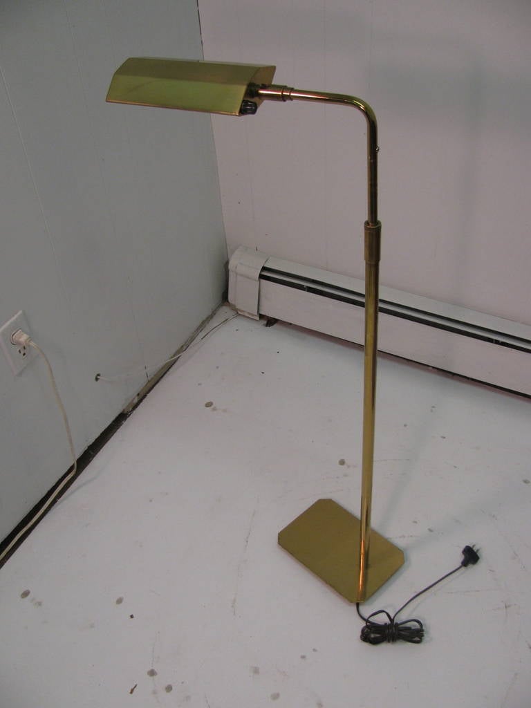 Solid brass floor lamp by Koch and Lowy. Fully adjustable to meet all your reading or lighting needs.