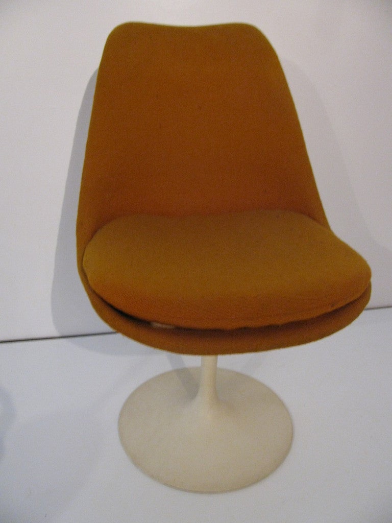 Set Of Four Eero Saarinen Chairs. Classic Design Screams Space Age Modern. All Chairs Are Labeled And Dated July 30, 1972. Chairs Swivel. Fabric And Upholstery Intact But Needs Updating, Frames are in Good Condition. Three In Yellow One In Orange
