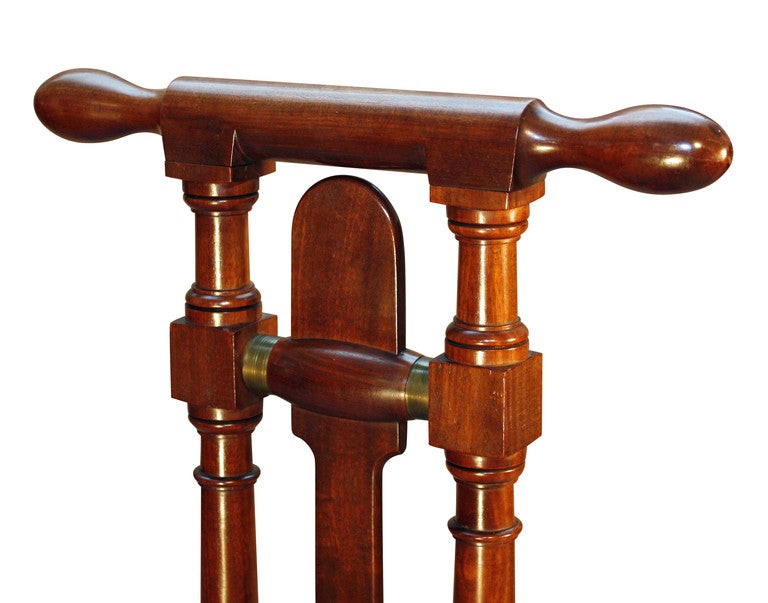 This freestanding mahogany Boot Jack can be attributed to Gillows. The user stands on the platform with one foot and places the other foot, with boot to be removed, between the turned uprights and into the throat. The throat has a further cut out in