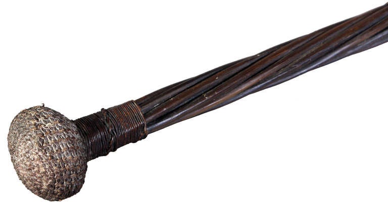 This Bosun’s Persuader or Cosh is made of twisted baleen, to give it a flexibility, with a lump of lead to either end. The lead is covered in a finely knotted string and the ends and centre of the baleen are held by tightly bound twine. Sailors were