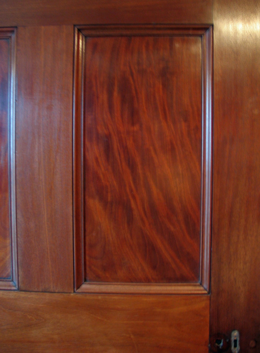 A Georgian solid mahogany six well figured panel door. Judging from its size this door would have been from an important house. The door has its original hinges but the handles and lock are missing, circa 1800.
