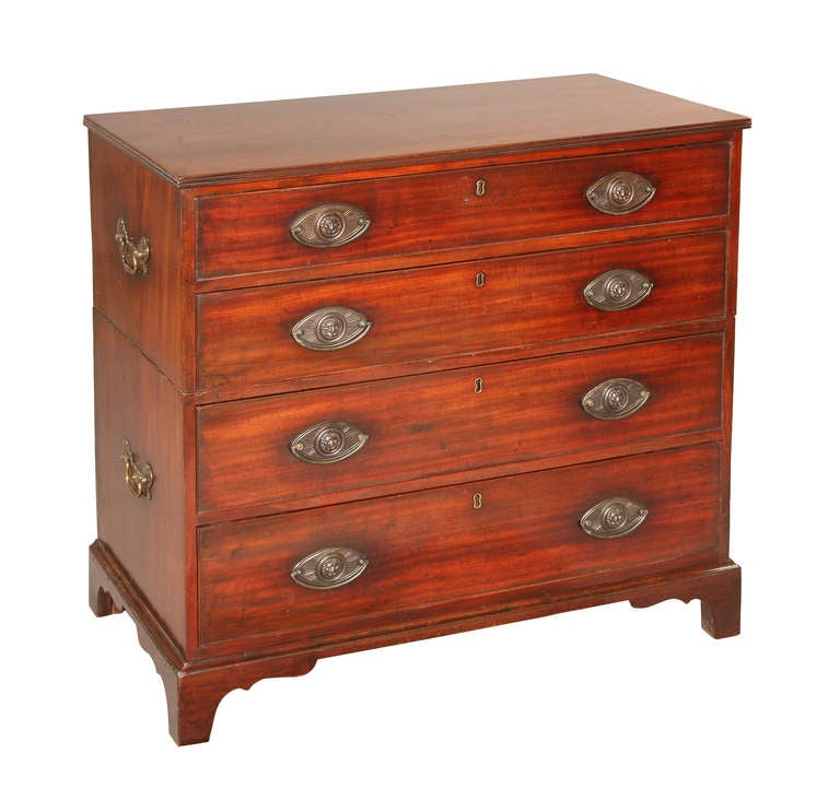 Although this Georgian mahogany chest is made to break down into 2 parts for travel it was made before many of the standard principles for a campaign chest were set. That is to say, the addition of brass corners and straps for strength and