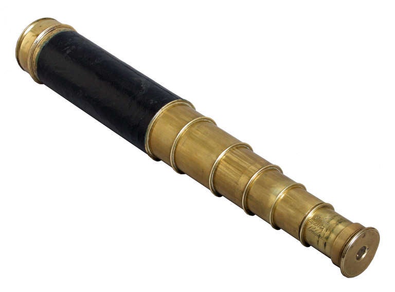 This 6 draw brass telescope has a leather grip and a built in sliding cover to the eye piece. The first draw is engraved J.P Cutts Sutton and Son, Opticians to Her Majesty, Sheffield and London. The second draw is engraved Adjusting Tube. There were